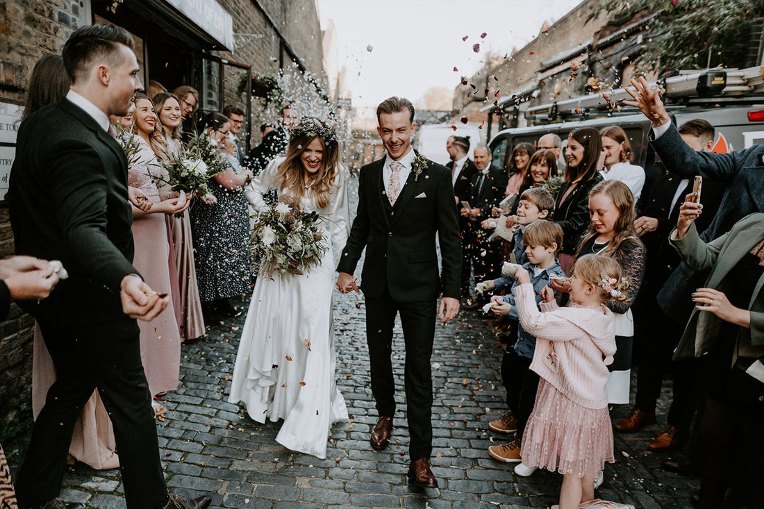 Our bride Izzie wearing our silk Olsen wedding dress
