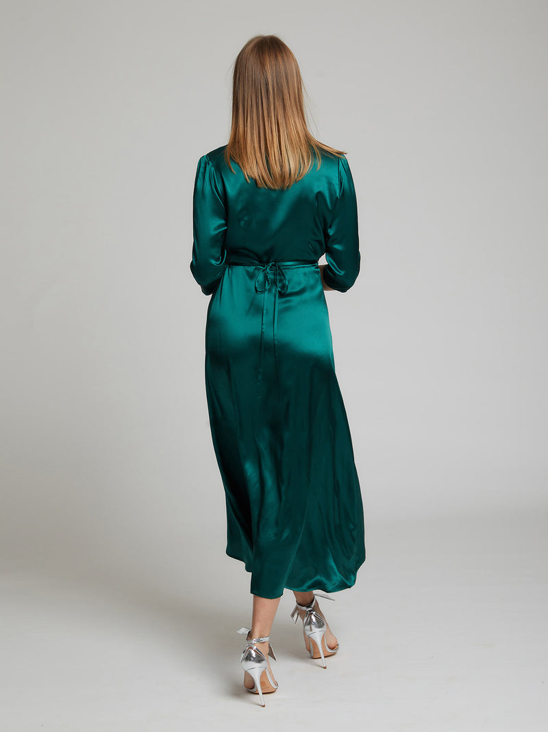 The back view of the Diana midi silk dress in winter green worn by Heloise Agostinelli