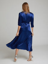 The rear view of the Diana midi silk dress in blue worn by Heloise Agostinelli